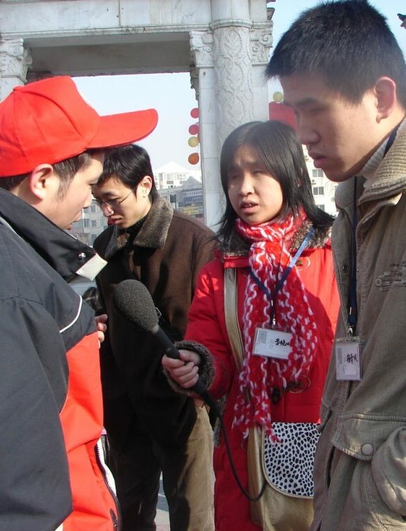     Visually impaired journalists interviewing in the street